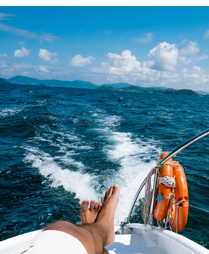 Man relaxing on a boat in the ocean
