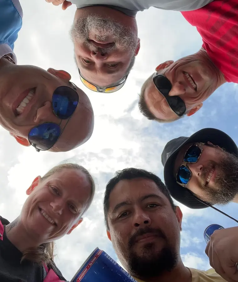 Smiling veterans enjoying time together on a fishing trip